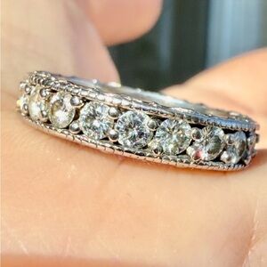 Sold.   14 karat gold, 4 carat diamond eternity band